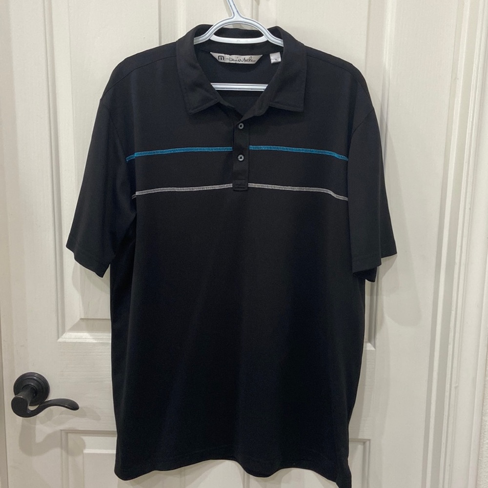 Travis Mathew Black Polo with Blue and Gray Stripe Accents